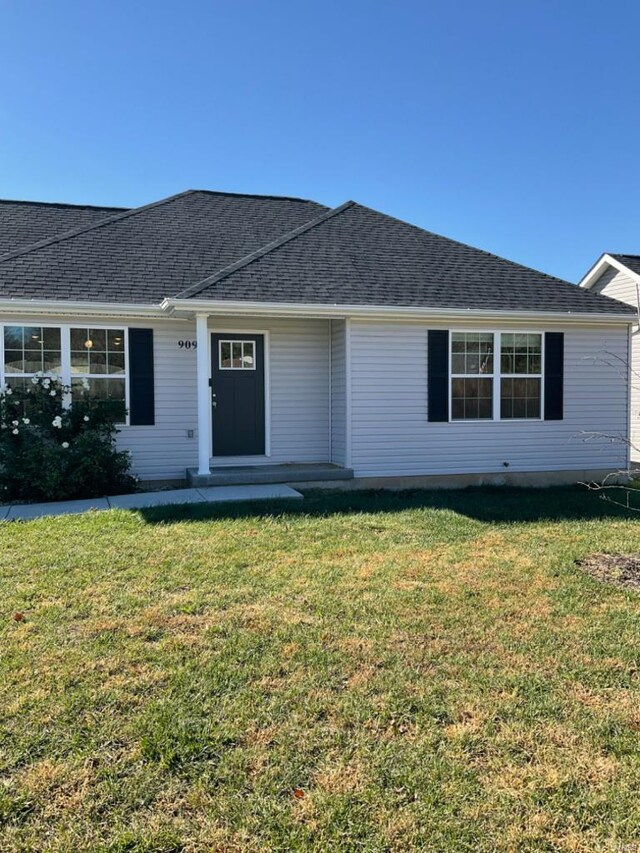 ranch-style home with a front yard