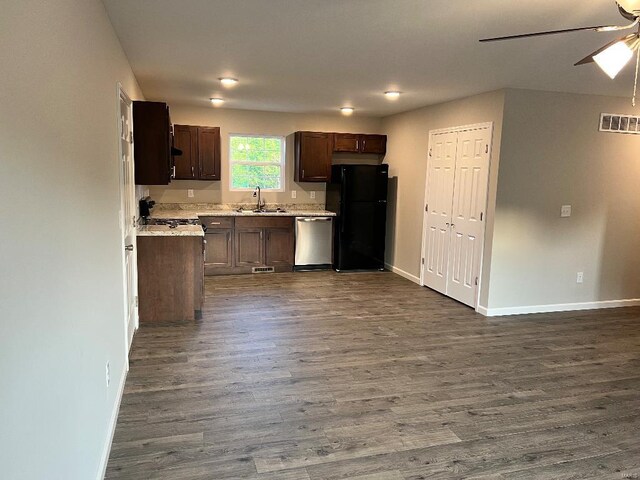 kitchen with ceiling fan, sink, black fridge, dark hardwood / wood-style flooring, and stainless steel dishwasher