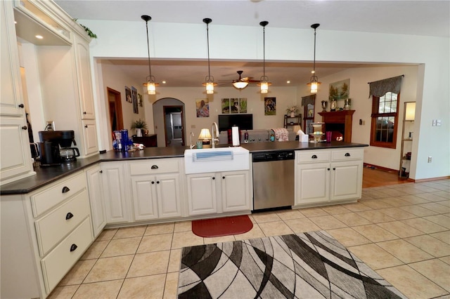 kitchen with pendant lighting, stainless steel dishwasher, and light tile patterned floors