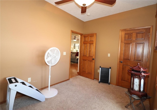 miscellaneous room with light colored carpet and ceiling fan