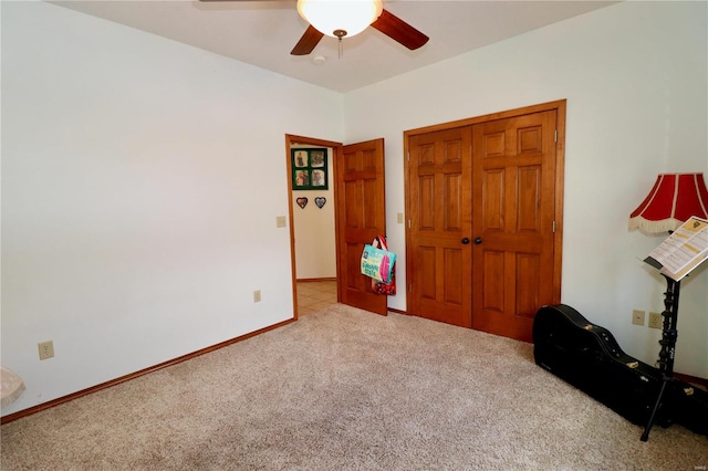 carpeted bedroom featuring ceiling fan