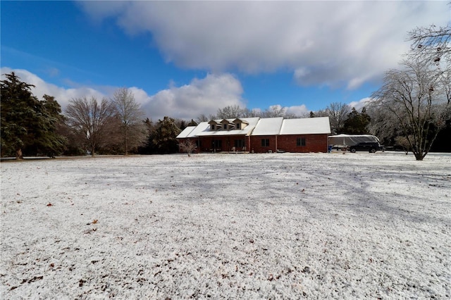 view of yard covered in snow