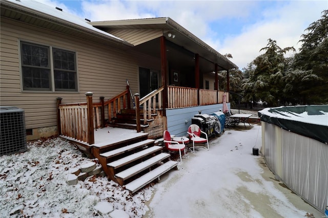 exterior space featuring a hot tub and central air condition unit