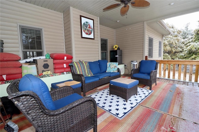 deck with ceiling fan and an outdoor hangout area