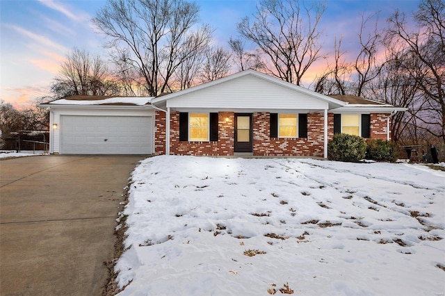 ranch-style house featuring a garage