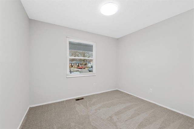 view of carpeted spare room