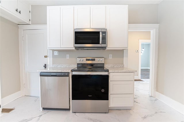 kitchen featuring white cabinets and appliances with stainless steel finishes