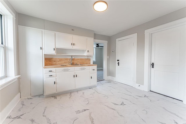 kitchen with white cabinets and sink