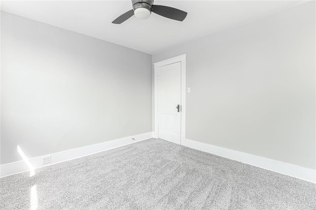 spare room featuring ceiling fan and carpet floors