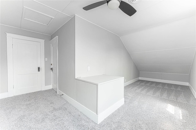 bonus room with ceiling fan, vaulted ceiling, and carpet flooring