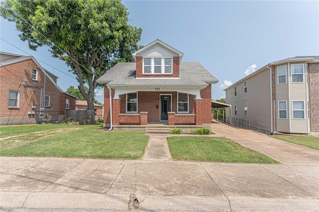 view of front of house featuring covered porch and a front yard