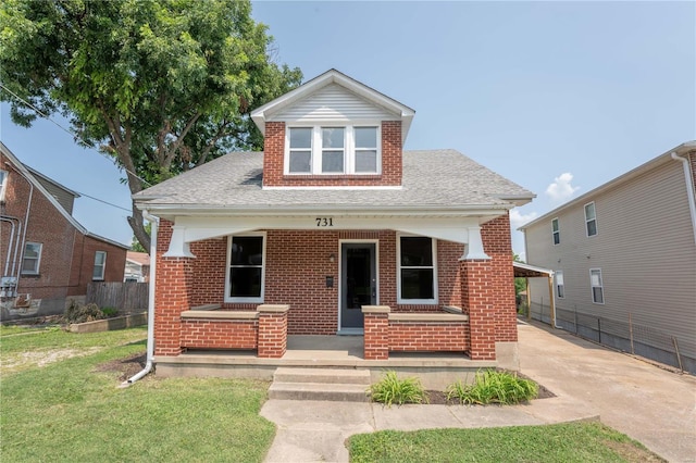 bungalow-style house with a porch and a front yard