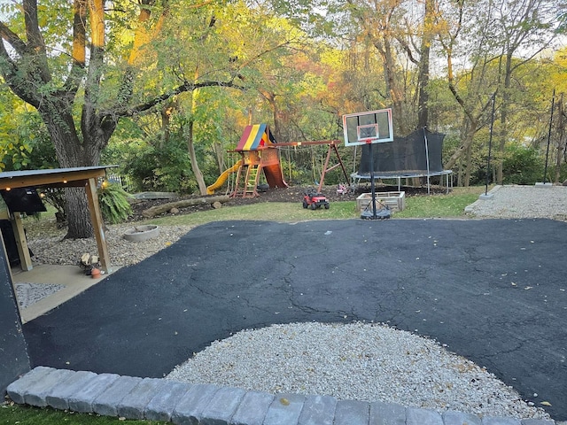 view of patio / terrace with a playground and a trampoline