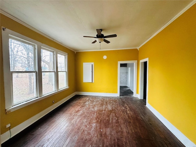 empty room with dark hardwood / wood-style flooring, ceiling fan, and ornamental molding