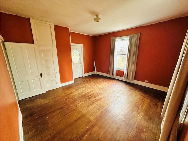 unfurnished bedroom with wood-type flooring