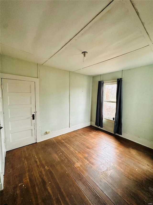 empty room featuring hardwood / wood-style flooring