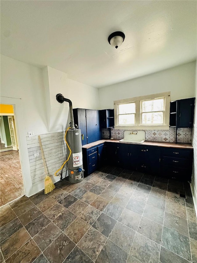 kitchen featuring backsplash and water heater