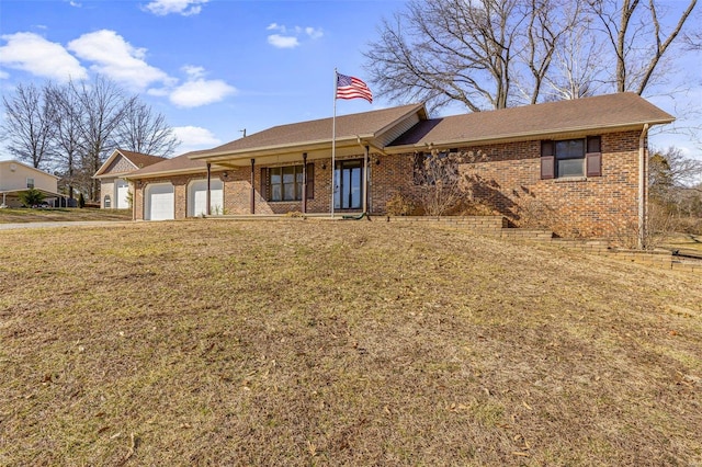 ranch-style house with a garage and a front yard