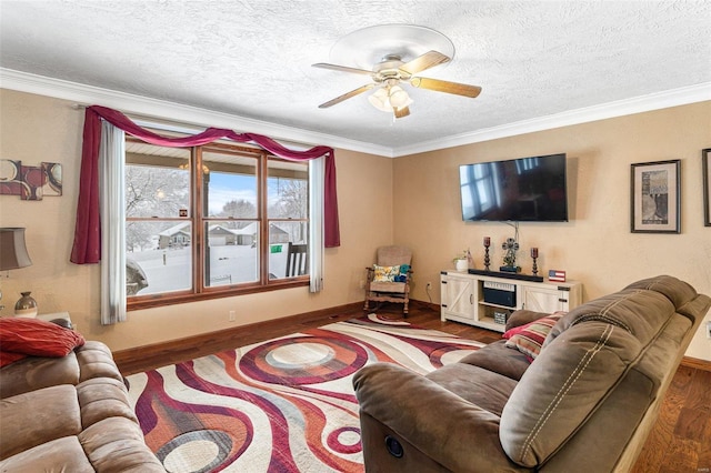 living room featuring crown molding, ceiling fan, hardwood / wood-style flooring, and a textured ceiling