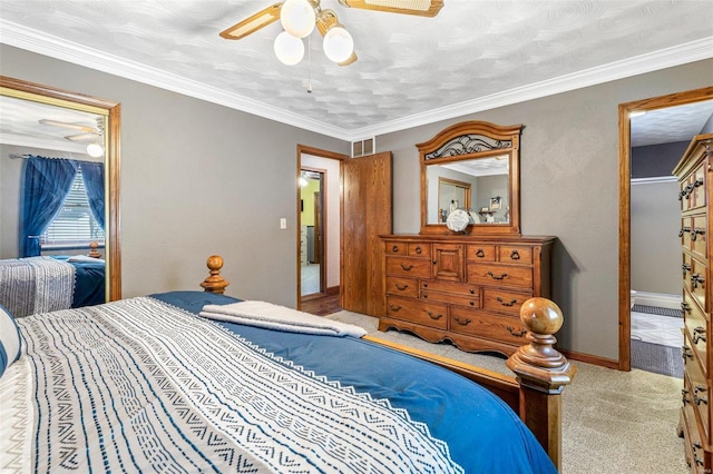 bedroom with ornamental molding, light colored carpet, and ceiling fan