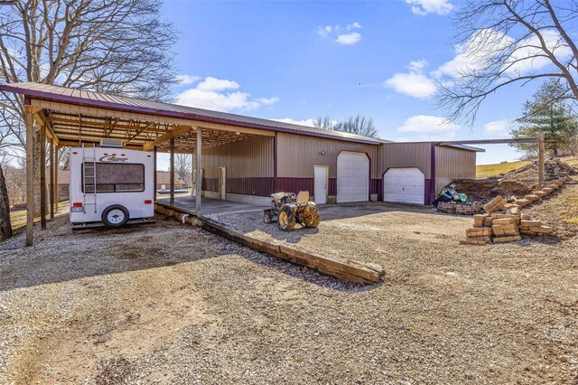 view of front of property featuring an outbuilding and a garage