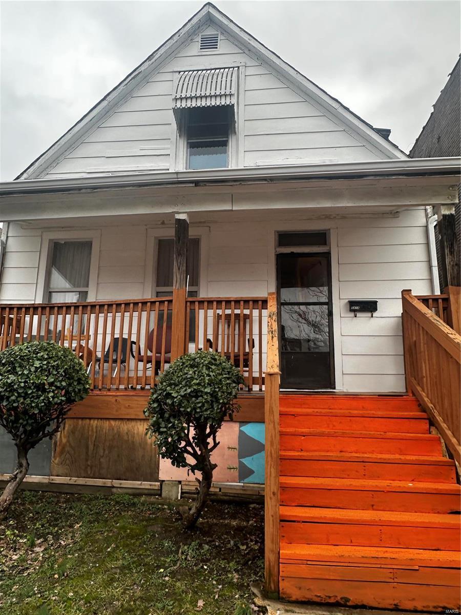 entrance to property with a porch