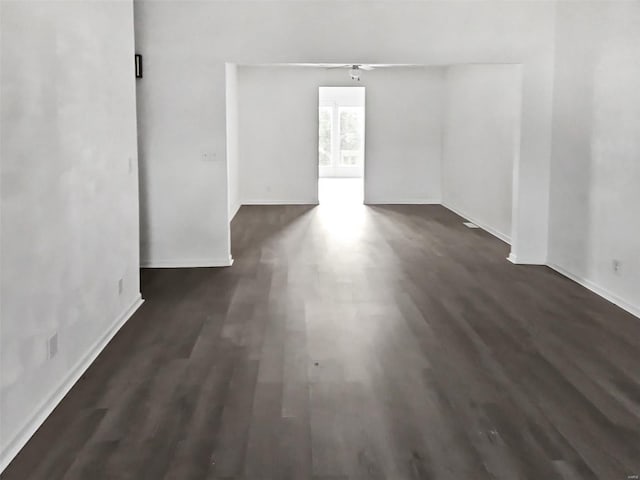 spare room with dark hardwood / wood-style flooring