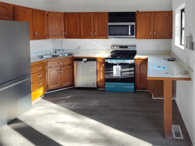 kitchen featuring stainless steel appliances and sink