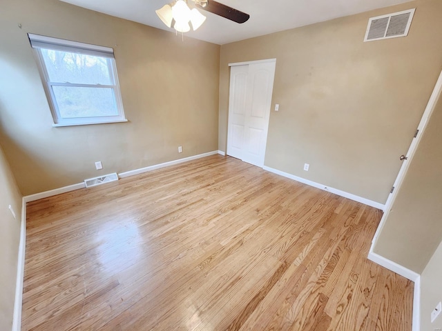 unfurnished room featuring ceiling fan and light wood-type flooring