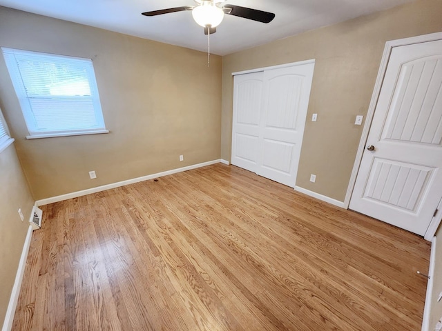 unfurnished bedroom featuring light hardwood / wood-style flooring and ceiling fan