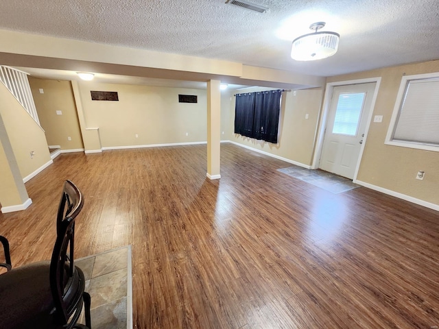 interior space featuring hardwood / wood-style floors and a textured ceiling