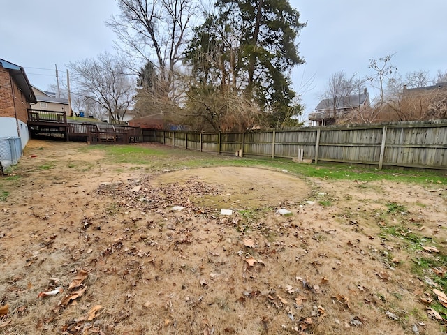 view of yard featuring a wooden deck