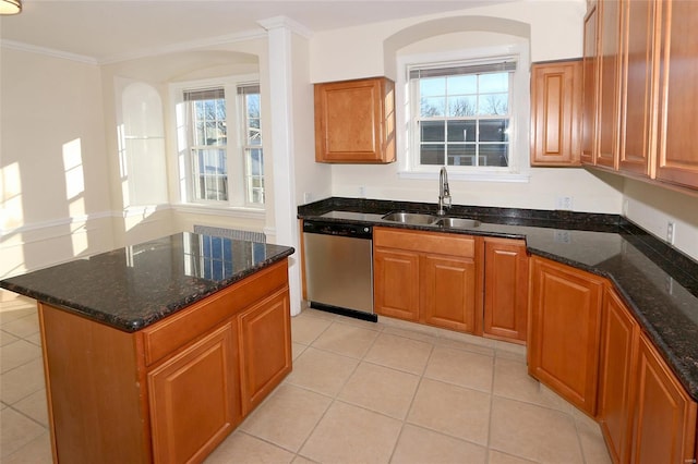 kitchen with crown molding, light tile patterned floors, stainless steel dishwasher, sink, and dark stone countertops