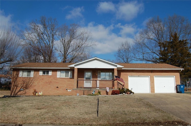 ranch-style house with a porch, a garage, and a front lawn