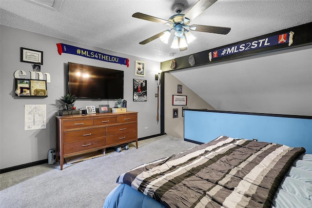 bedroom featuring ceiling fan, light carpet, a textured ceiling, and lofted ceiling