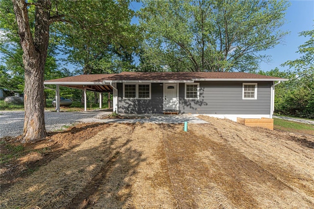 view of front facade with a carport