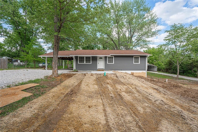 ranch-style house with a carport