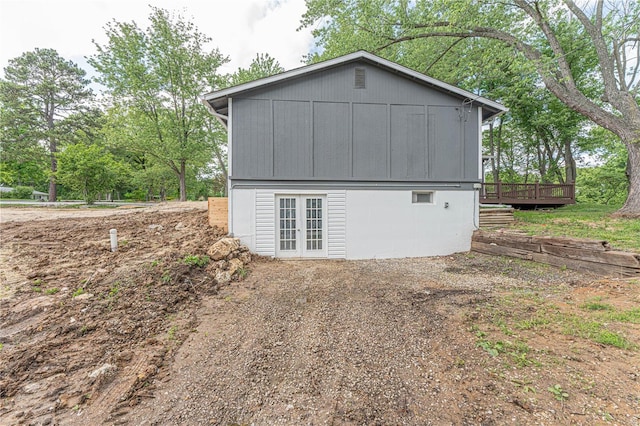 view of side of property featuring a wooden deck