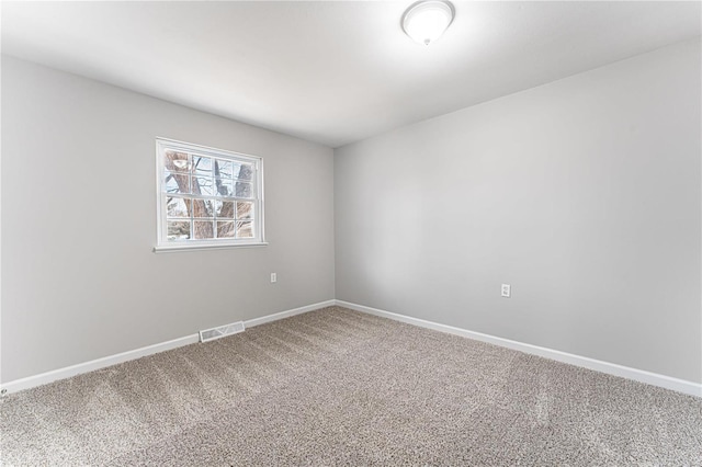 empty room featuring carpet floors