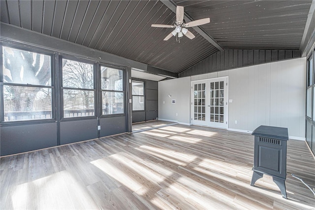 unfurnished sunroom with lofted ceiling and ceiling fan