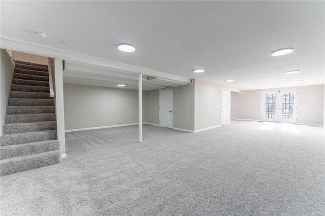 basement featuring carpet floors and french doors