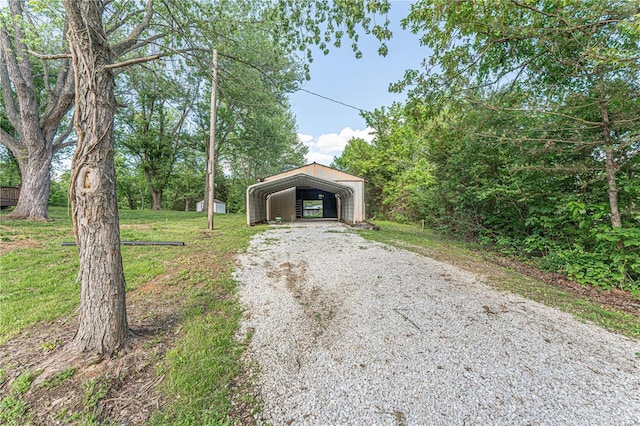 view of front of property with a front yard and a carport