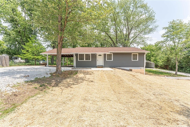 ranch-style home with a carport