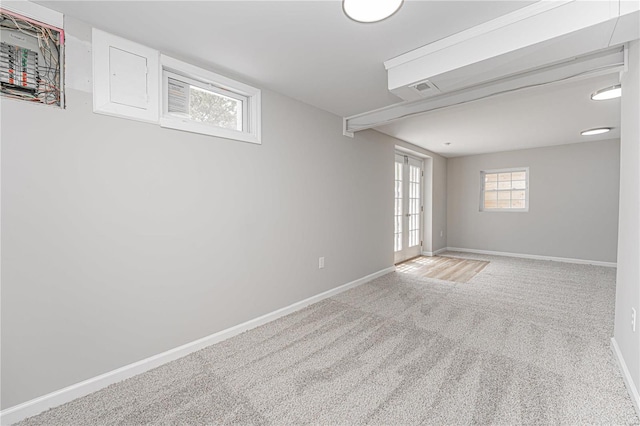 basement with french doors and carpet