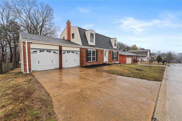 cape cod-style house with a garage and a front yard