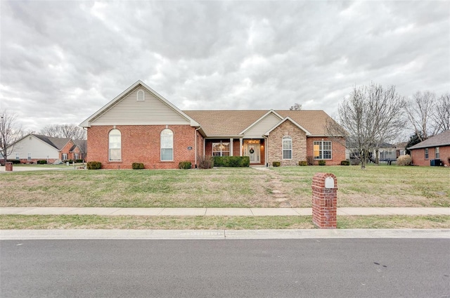 ranch-style home with a front lawn