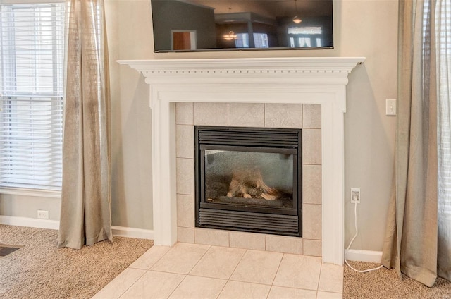 interior details featuring carpet flooring and a fireplace