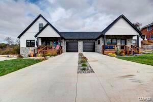 modern farmhouse style home with a garage