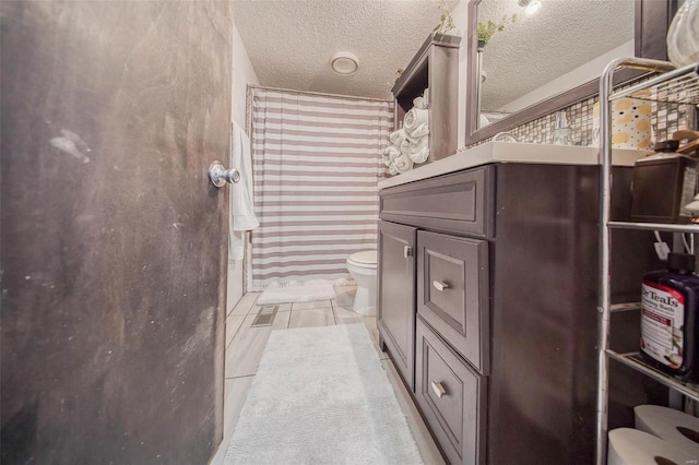 bathroom featuring toilet, walk in shower, and a textured ceiling