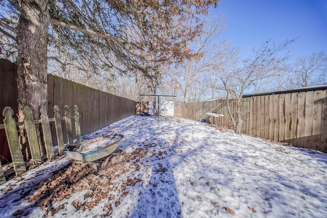 view of yard layered in snow